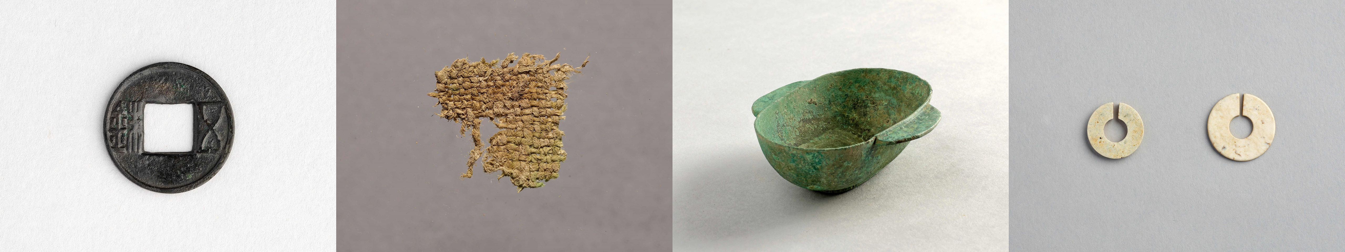 香港出土汉代文物，左起：五铢钱、麻布残件、青铜耳杯和玉玦。（古物古迹办事处藏）